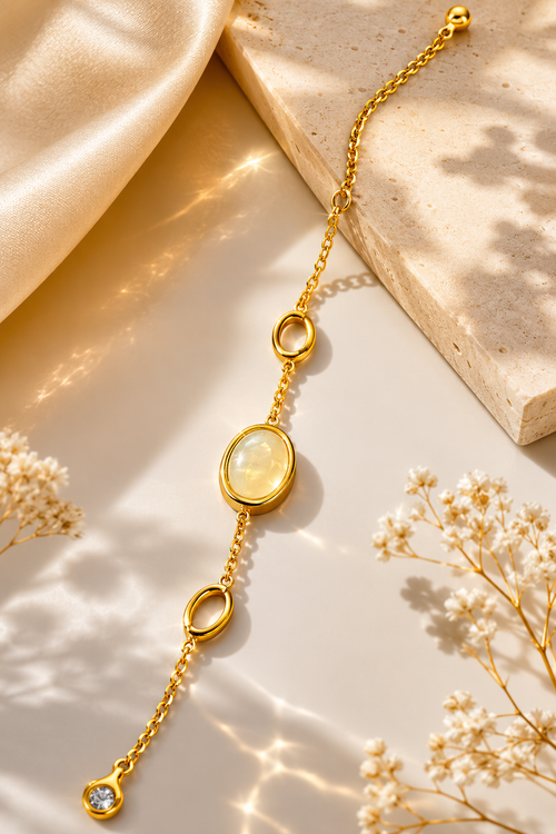 The Aurora Opal Bracelet styled on ivory silk with delicate florals